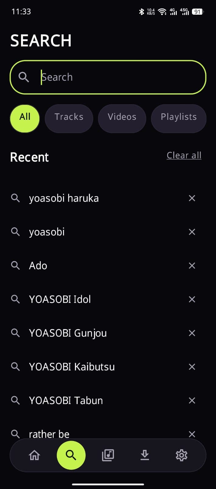 Search screen with an empty field, filters for tracks, videos and playlists, and a list of recent searches that can be cleared individually