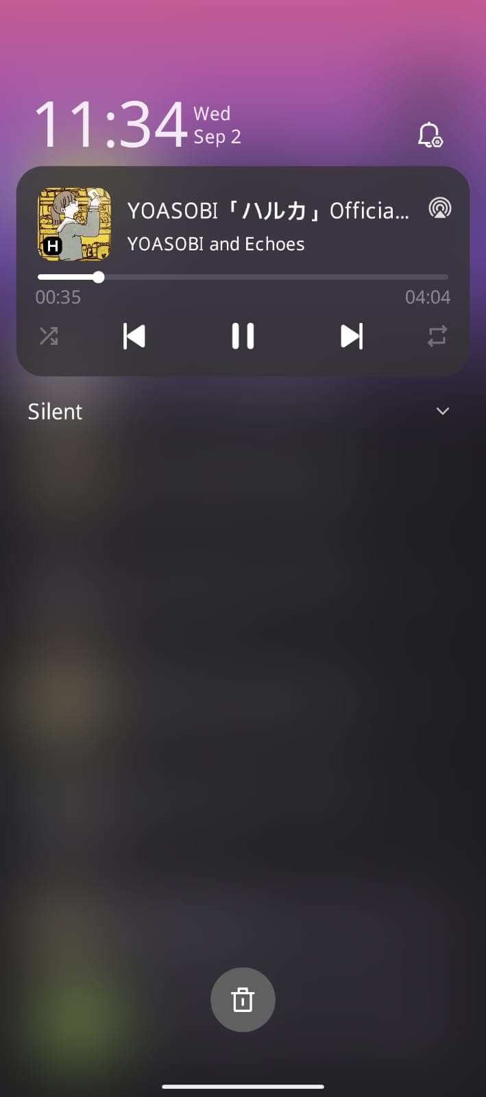 Lock screen showing the media notification with cover art, track title, a progress bar at thirty-five seconds, and shuffle, skip, pause and repeat controls